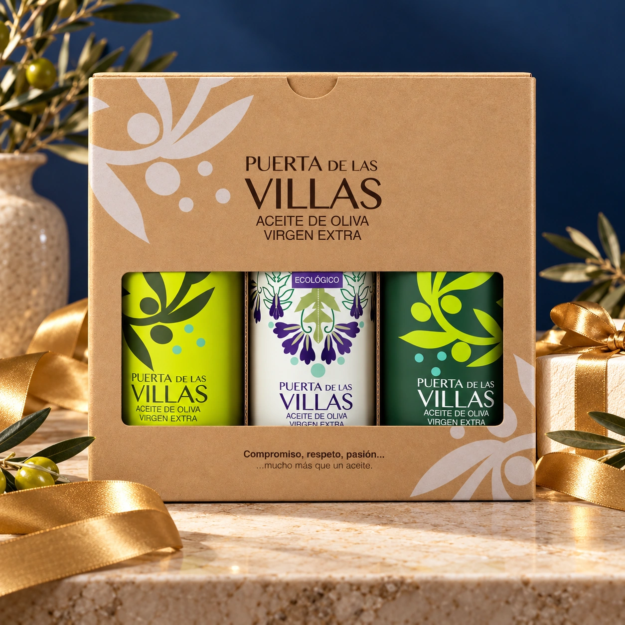 Estuche Puerta de Las Villas con Picual Envero, Picual Temprano Ecológico y Picual Temprano, en un escenario de celebración elegante.